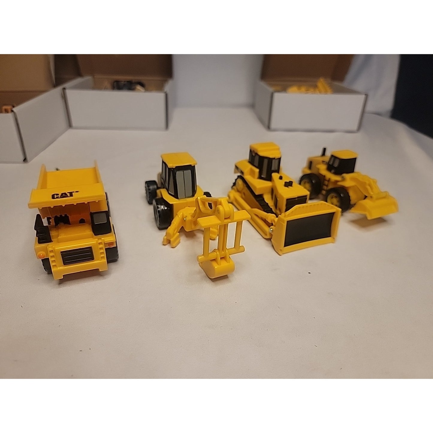 Lot of 4 Caterpillar Style Plastic Construction Vehicles Toys Truck 4" to 6"