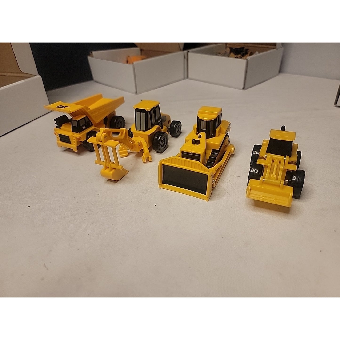 Lot of 4 Caterpillar Style Plastic Construction Vehicles Toys Truck 4" to 6"