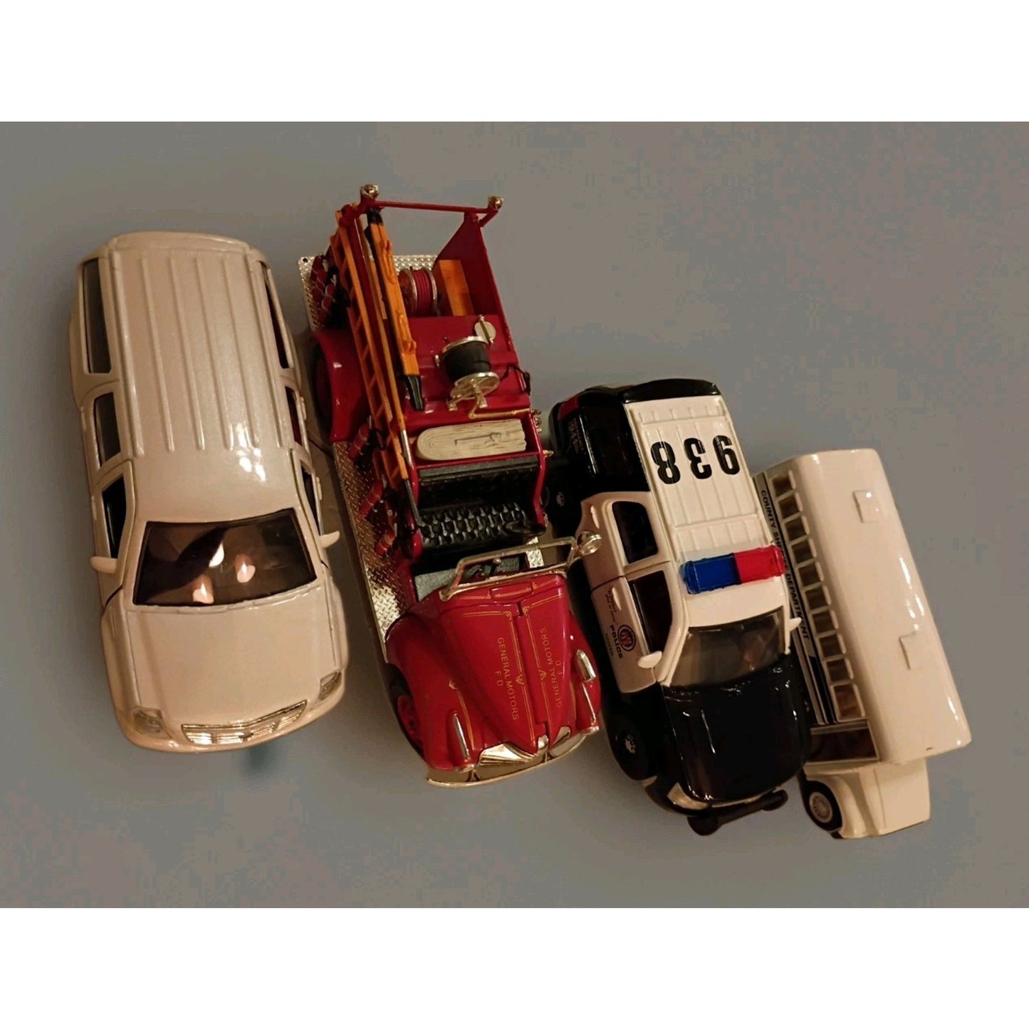 Lot of 4 Diecast Vehicles Police, Fire, Sheriffs Bus, Escalade Chase Vehicle
